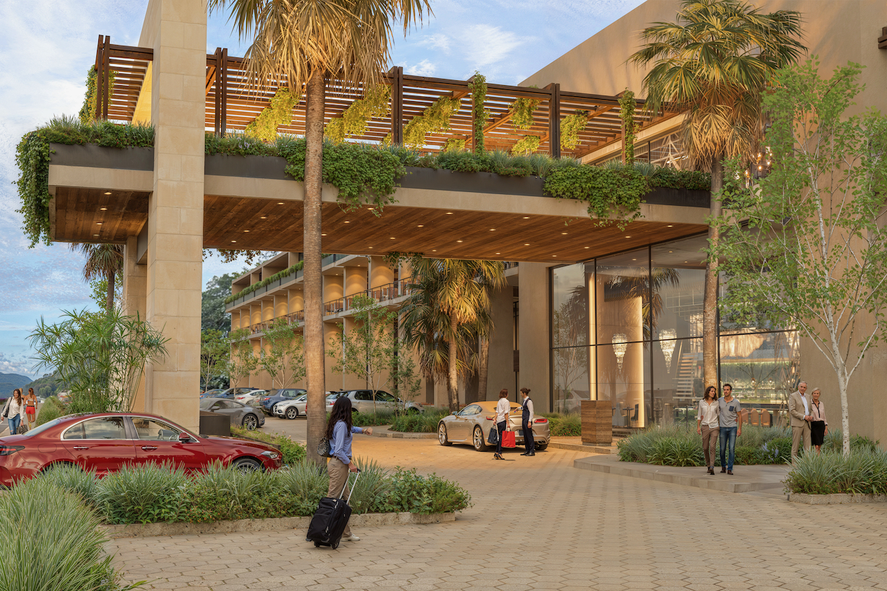 Lobby principal de Kharma Plaza con diseño contemporáneo y ambiente de hospitalidad premium.