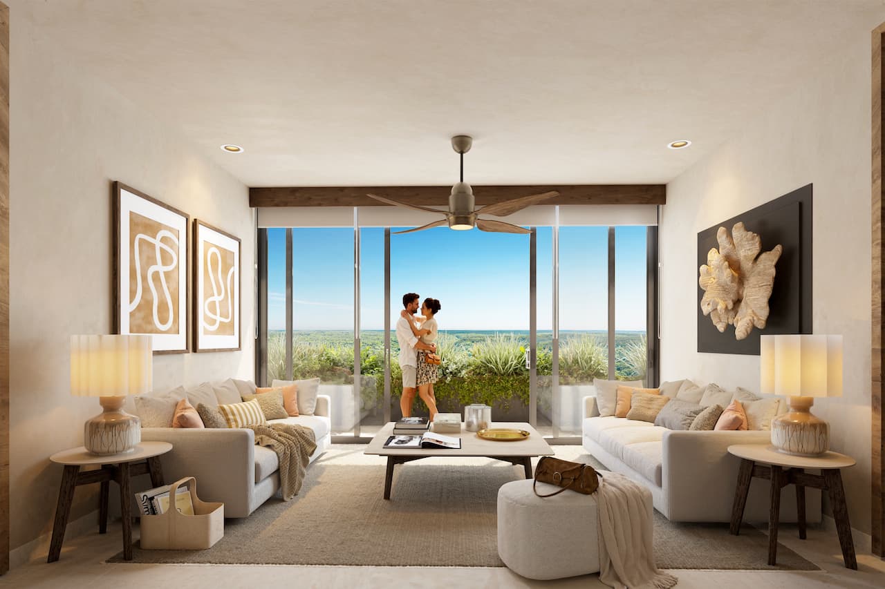 Sala de estar con vista a la Riviera Maya en residencia fraccional Kahatsa'